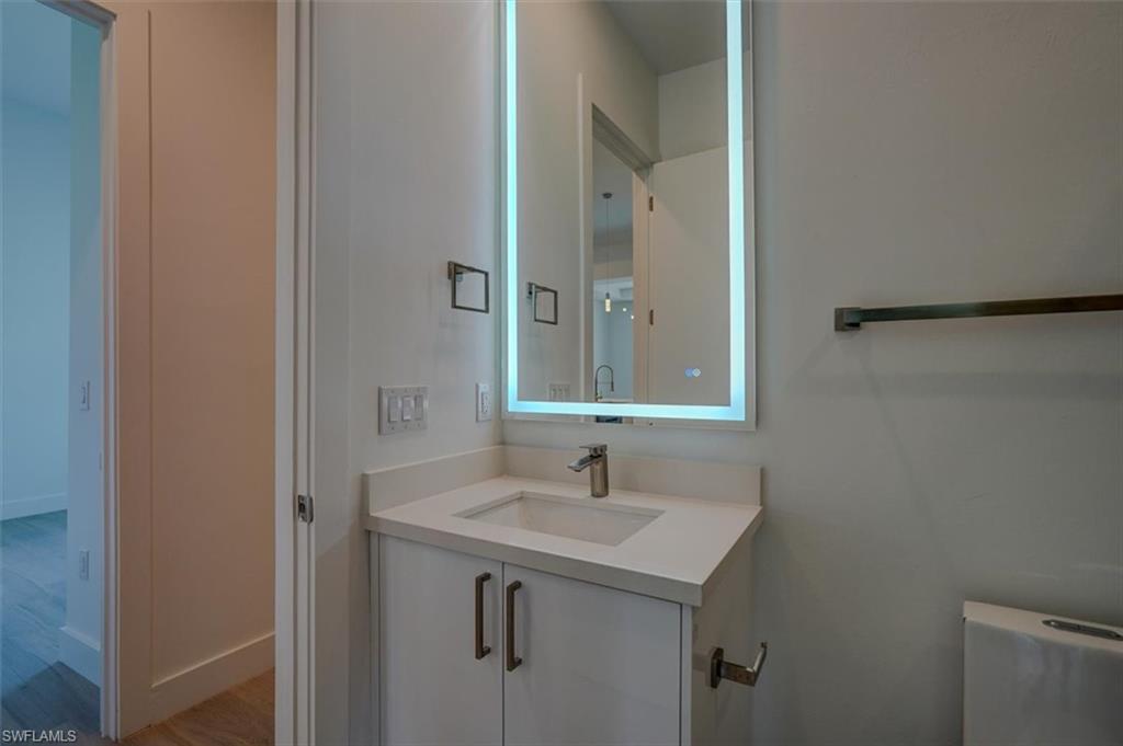 Bathroom with vanity and hardwood / wood-style flooring