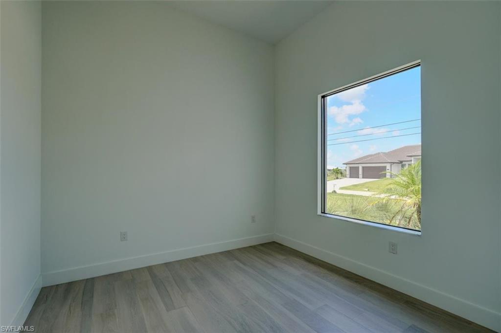 Empty room featuring light wood-type flooring