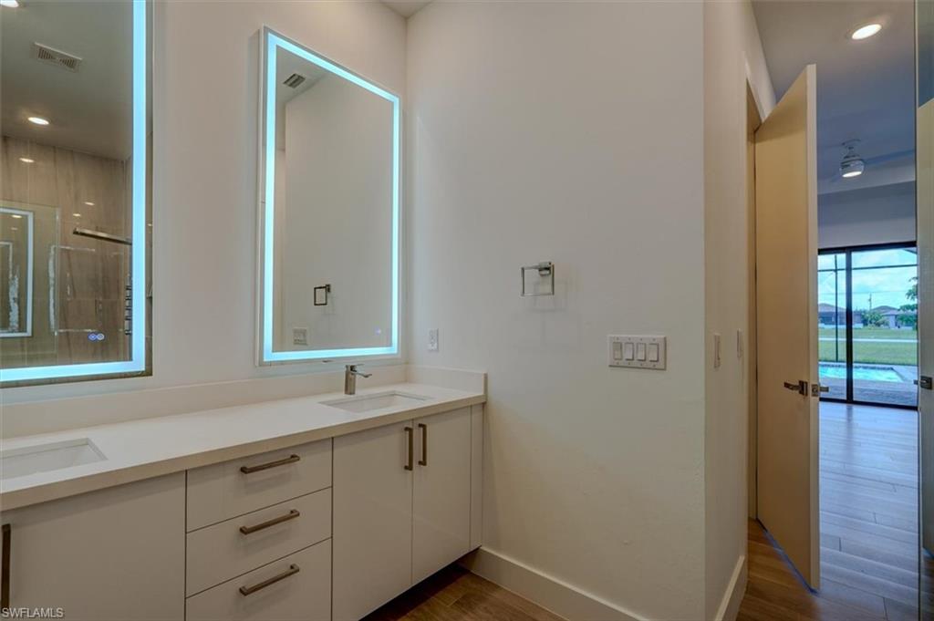 Bathroom featuring vanity and hardwood / wood-style flooring