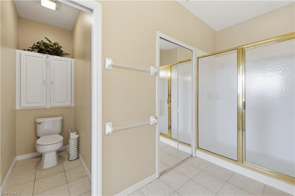 Full bathroom with a shower stall and light tile patterned floors