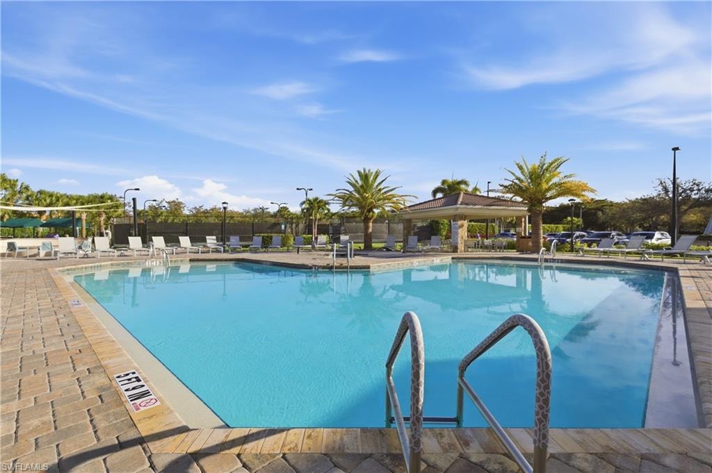 Community pool featuring a patio and a gazebo