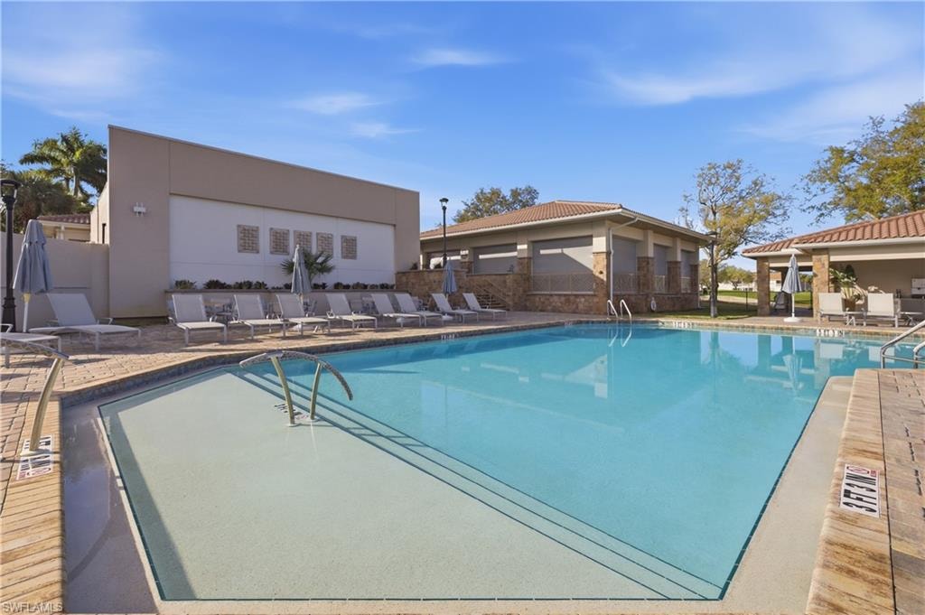 Community pool featuring a patio