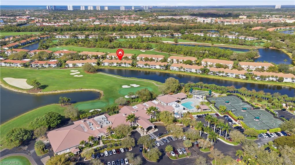 Aerial overview of property's location with a nearby body of water and a golf club