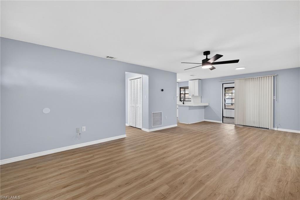 Unfurnished living room with ceiling fan, light wood-type flooring, and recessed lighting