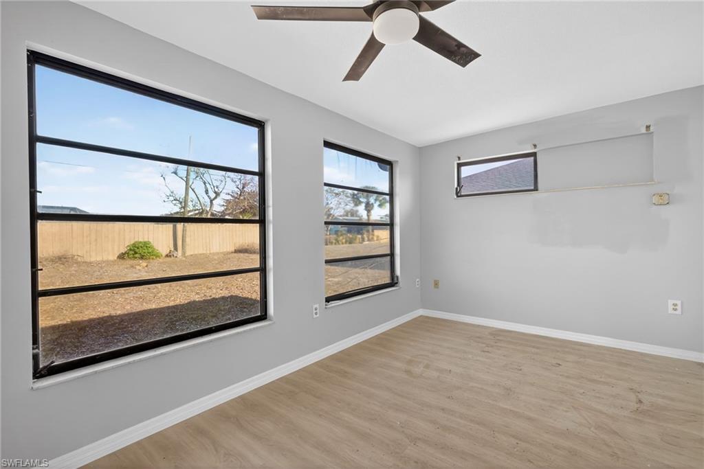 Unfurnished room featuring ceiling fan and light wood finished floors