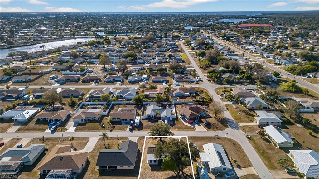 Aerial overview of property's location featuring nearby suburban area