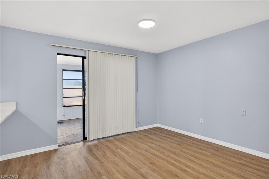 Unfurnished bedroom with light wood-type flooring and baseboards