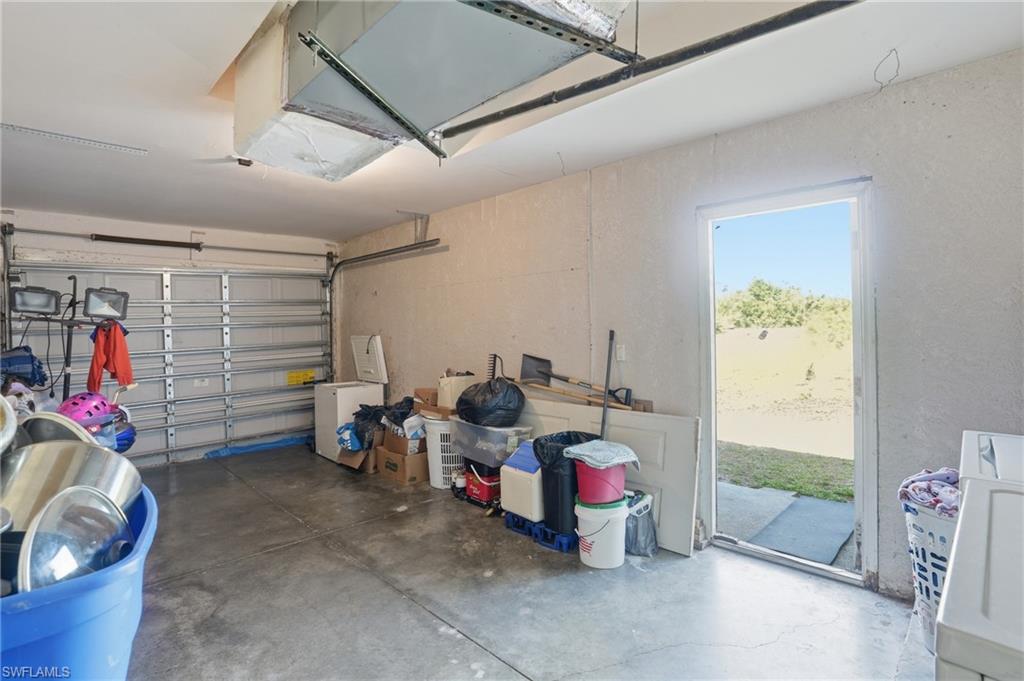 Garage with white fridge