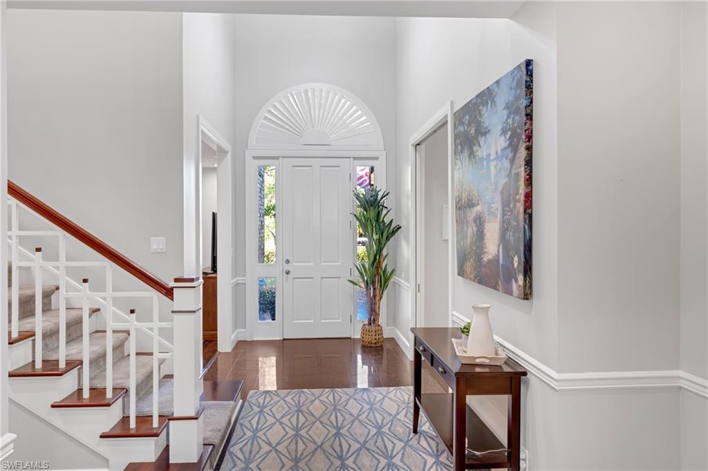 Entryway featuring a high ceiling and stairway