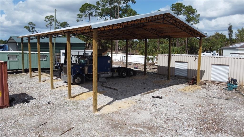 View of patio / terrace with a detached carport