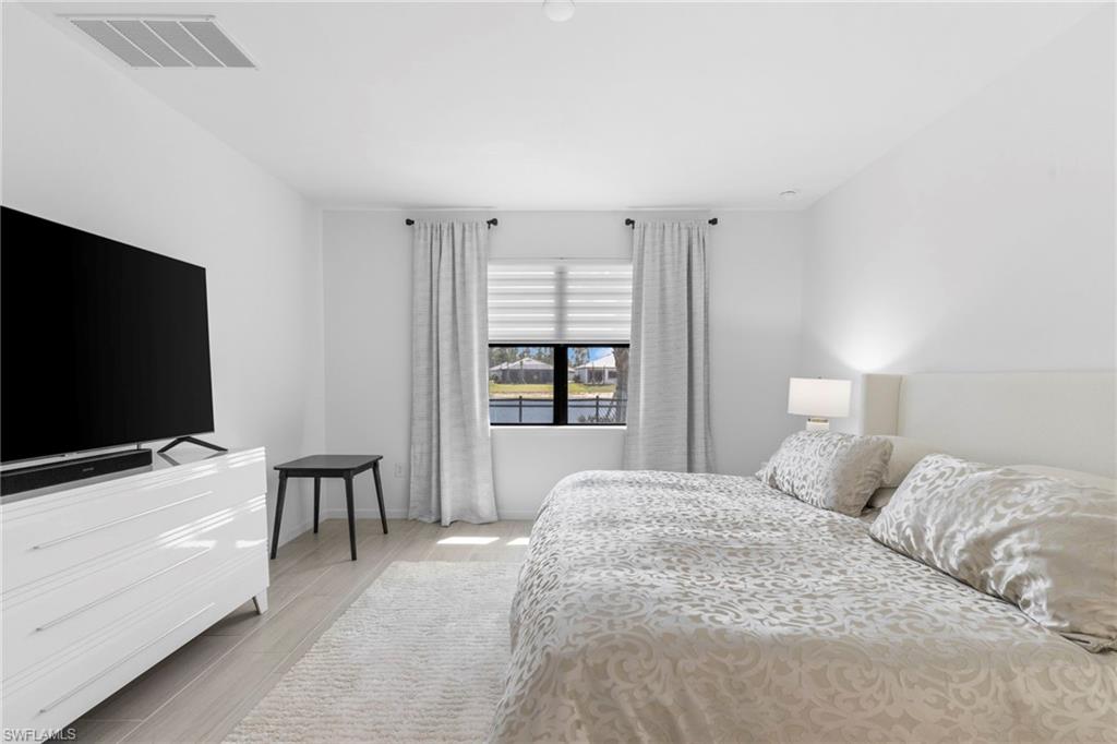 Master bedroom looks out over the lake.
