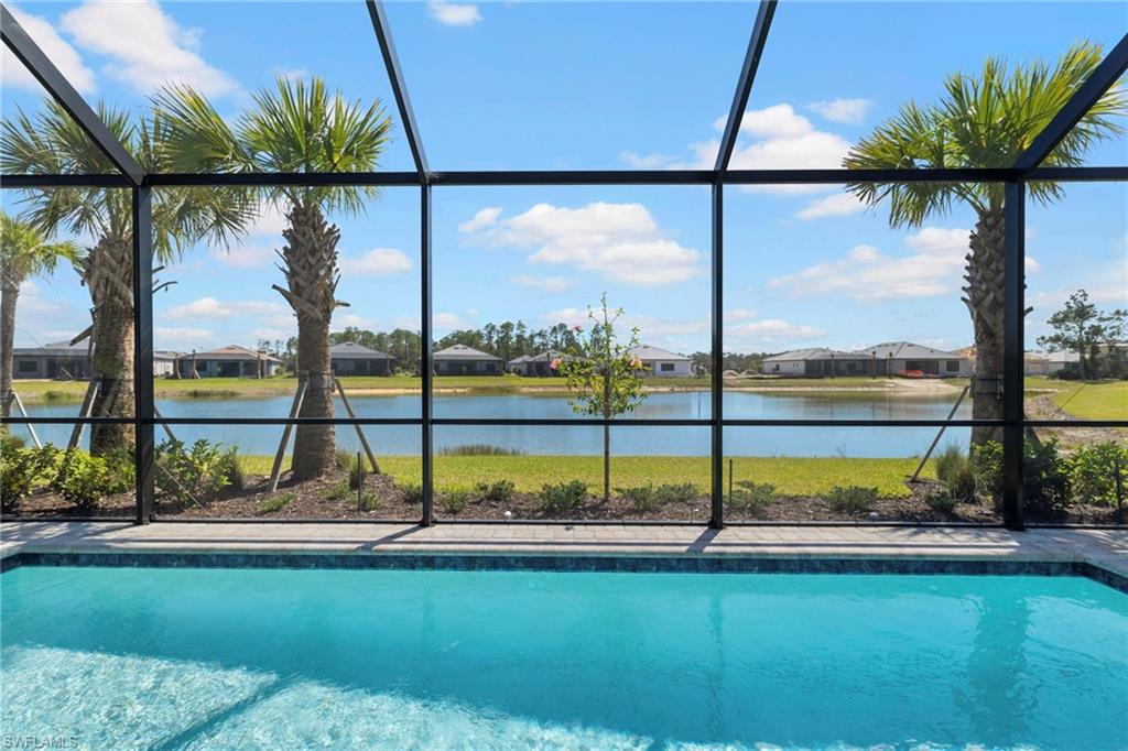 The pool looks out over a serene lake.