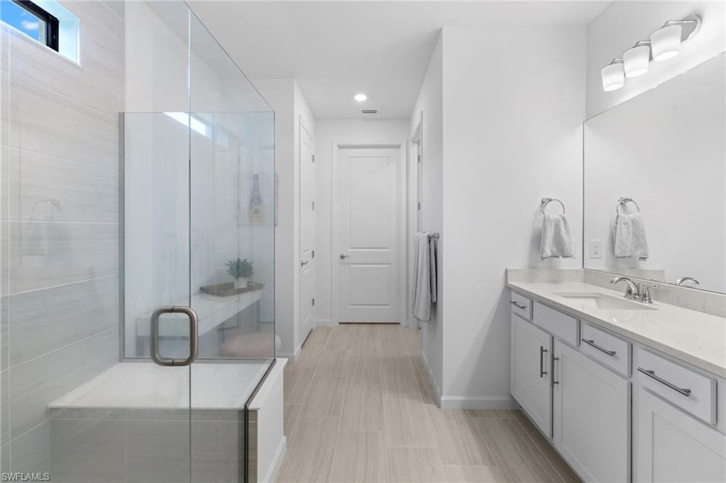 Owner's bathroom has a walk in spa like shower with double vanities and a huge walk in closet.