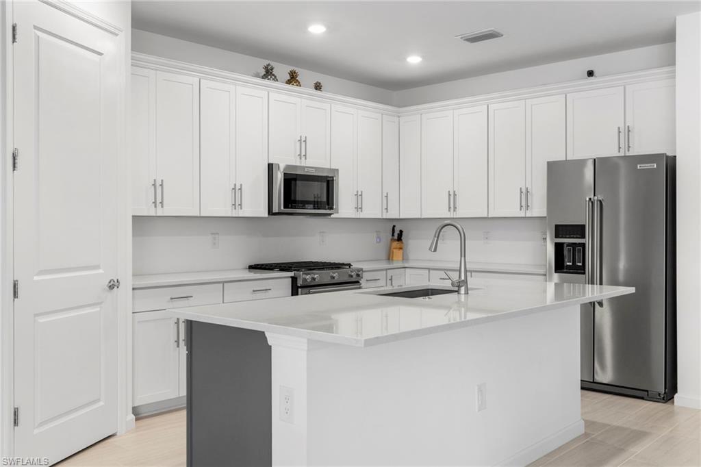 The kitchen has stainless appliances throughout along with a huge walk in pantry.