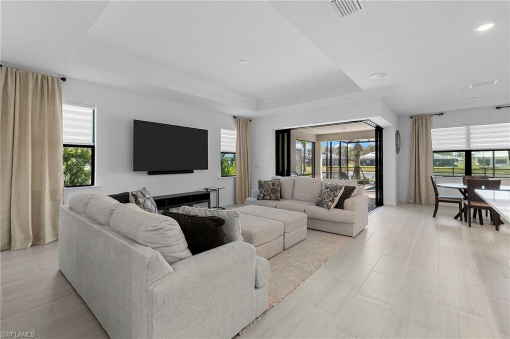 Beautiful living room layout and furniture along with zero corner sliding glass doors.
