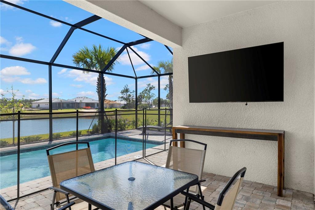 Pool dining area + outdoor television.