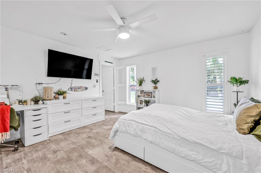 Bedroom featuring ceiling fan and light wood-type flooring