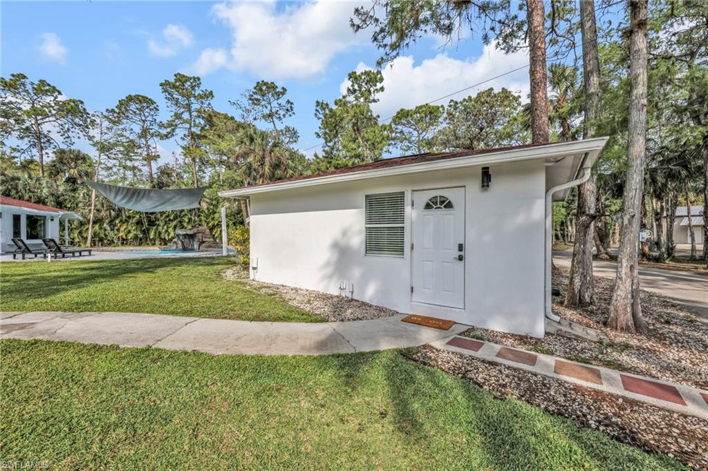 View of outbuilding with an outdoor pool