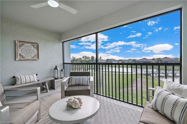 Sunroom featuring ceiling fan