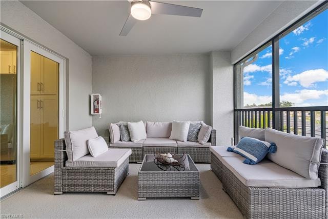 Sunroom / solarium featuring ceiling fan and a wealth of natural light