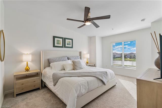 Carpeted bedroom with ceiling fan