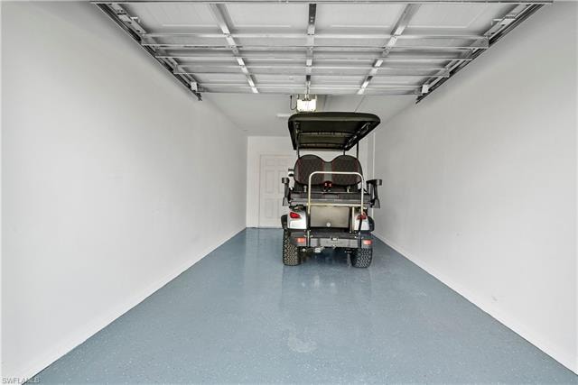 Garage featuring a garage door opener