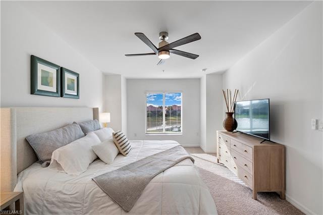 Carpeted bedroom with ceiling fan