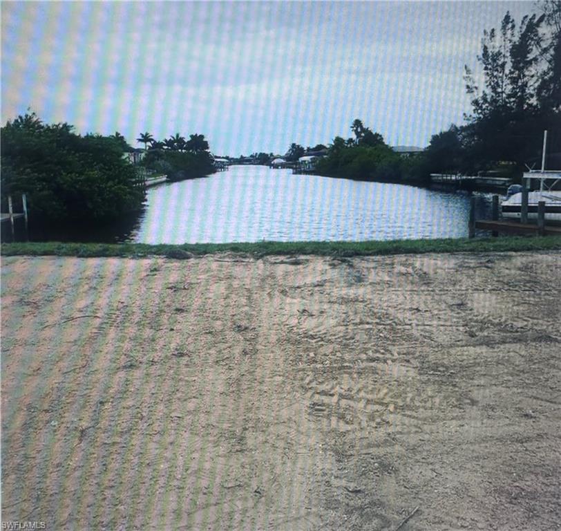 Water view with a boat ramp and a boat dock