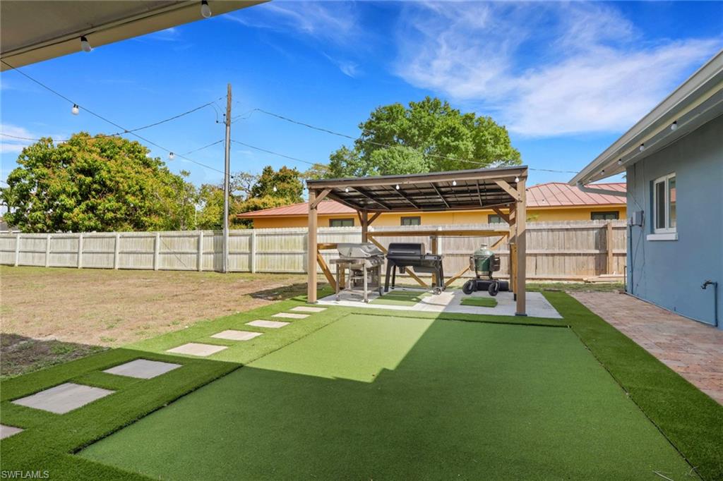 Fenced backyard featuring a patio