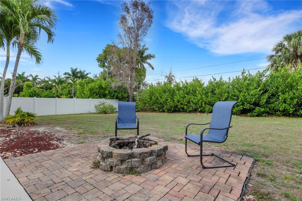 View of patio featuring an outdoor fire pit