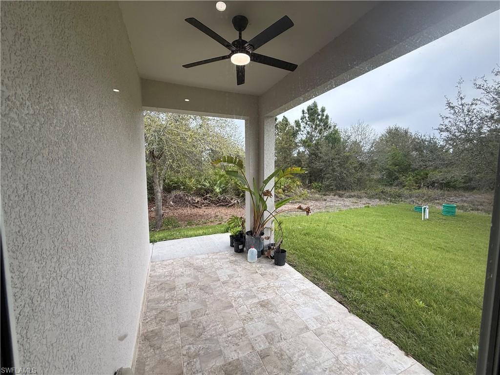 View of patio featuring a ceiling fan