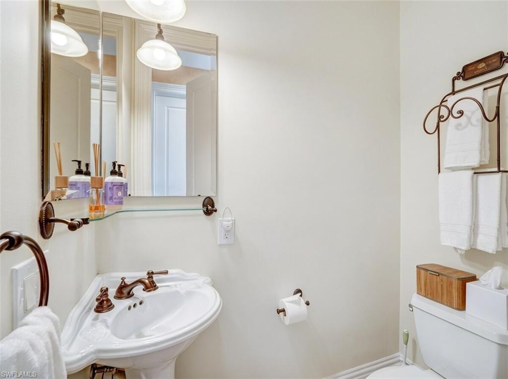 Bathroom with toilet and a sink - Virtually Edited Image