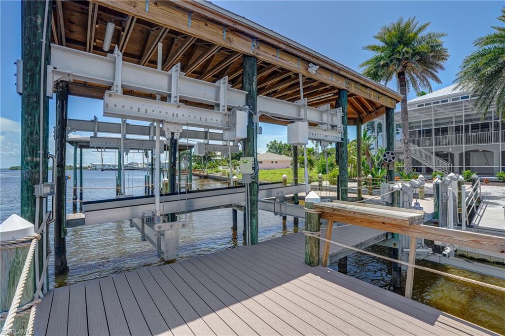 Dock with boat lift and a water view - Virtually Edited Image