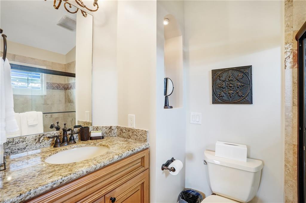 Full bathroom featuring vanity and a stall shower - Virtually Edited Image