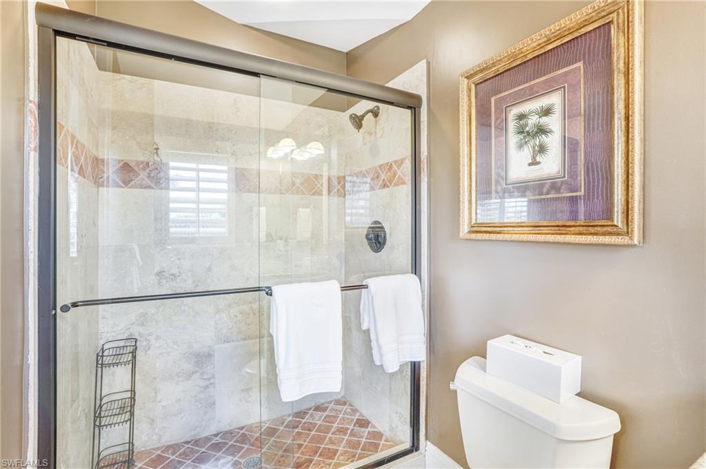 Bathroom with toilet and a stall shower - Virtually Edited Image
