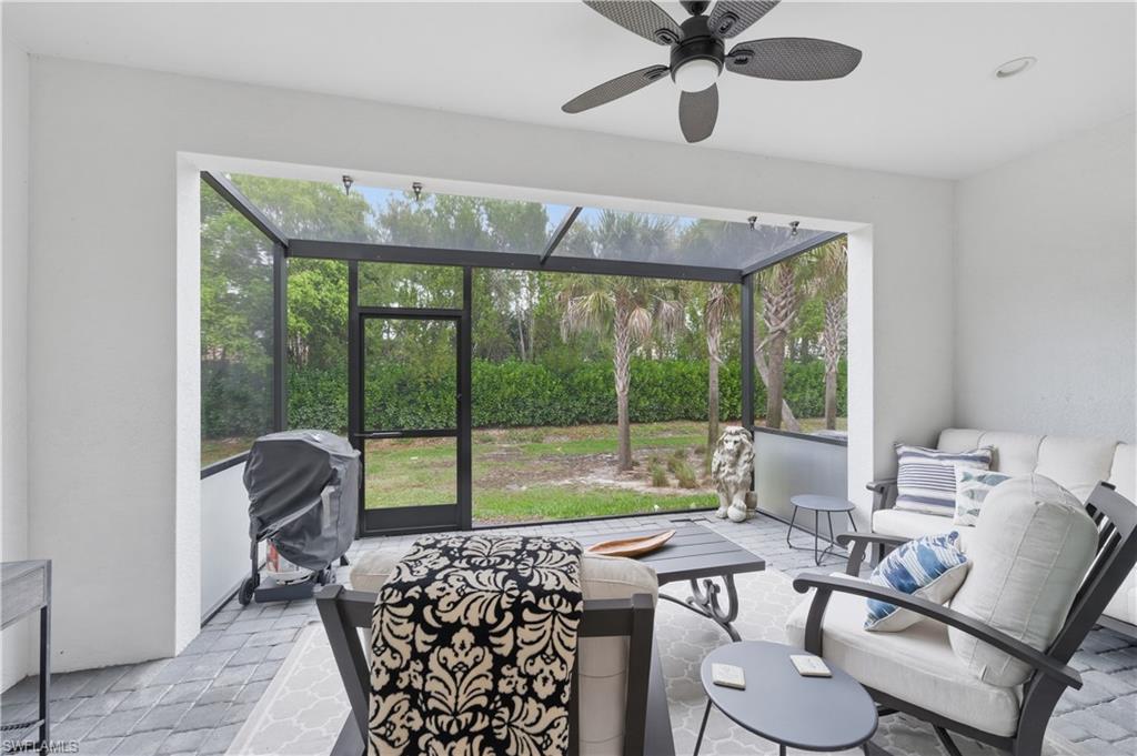 Sunroom / solarium featuring an outdoor lounge area, a ceiling fan, and plenty of natural light