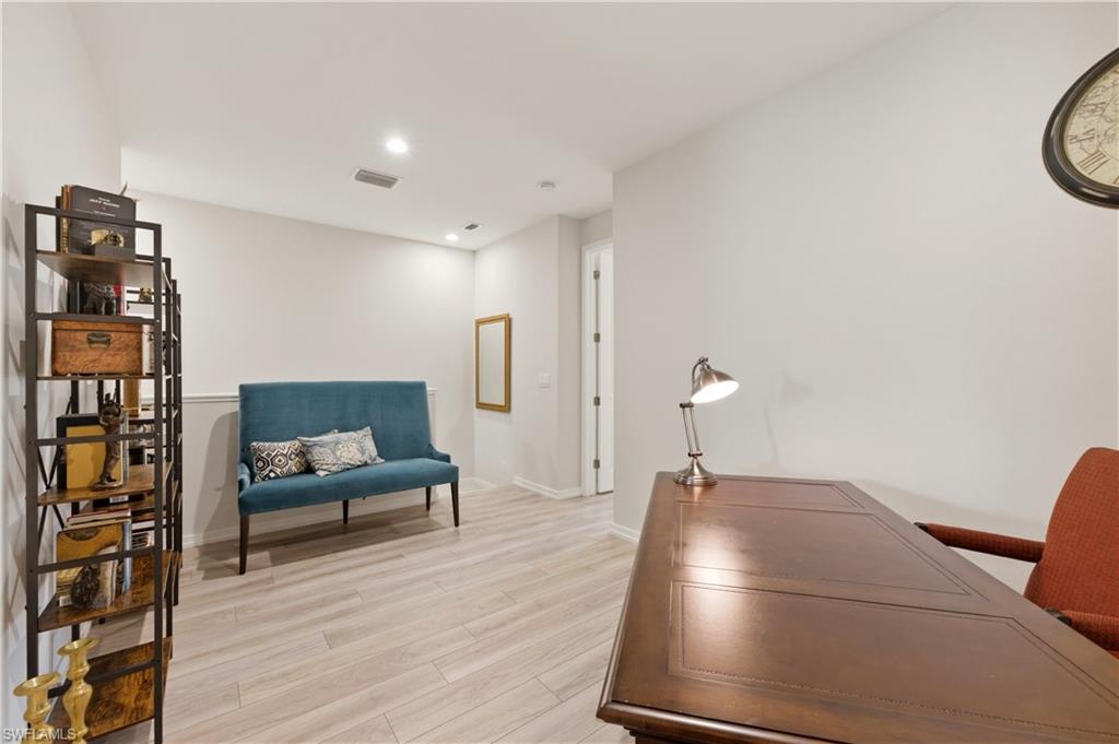 Office featuring light wood-style floors and recessed lighting