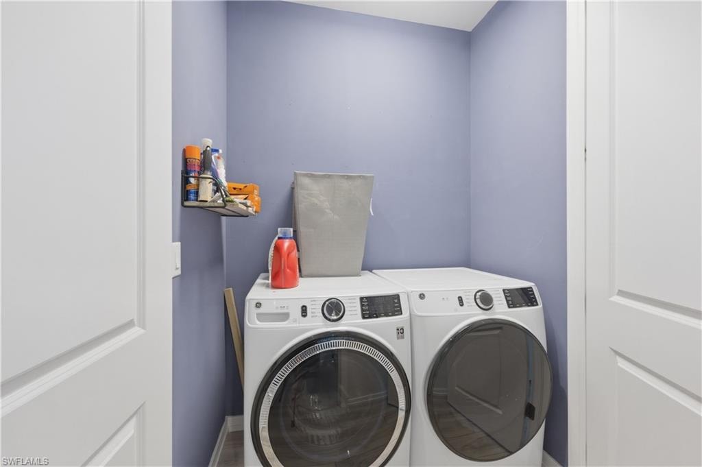 Laundry area featuring washing machine and clothes dryer
