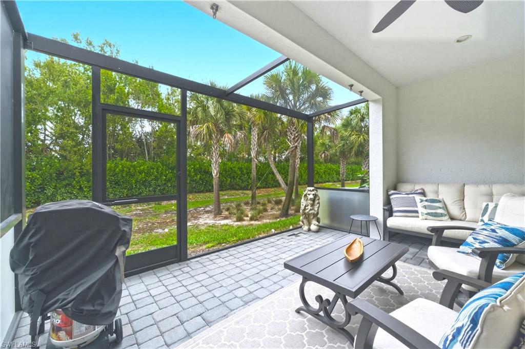 Sunroom with an outdoor lounge area, ceiling fan, and a patio area