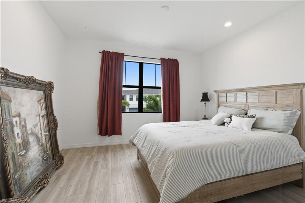 Bedroom featuring light wood-type flooring and recessed lighting