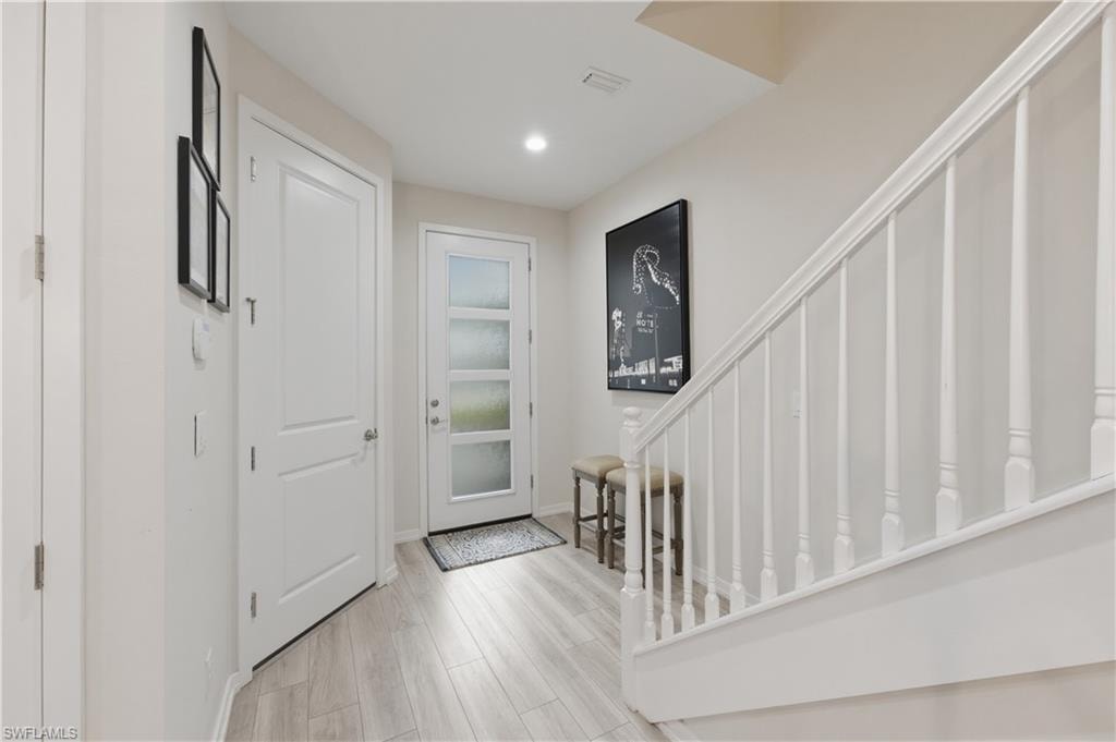 Entrance foyer featuring light wood-style flooring and recessed lighting