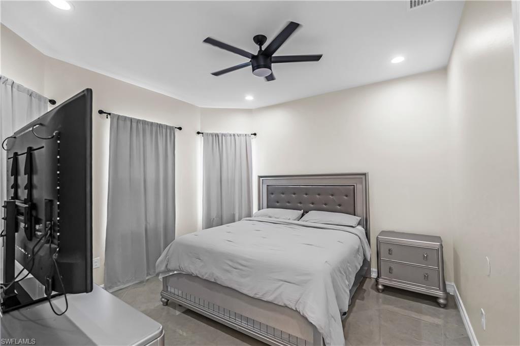Bedroom featuring recessed lighting and a ceiling fan