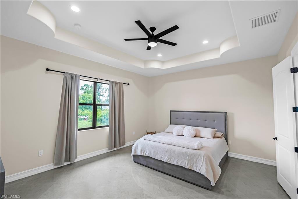 Recessed ceiling with an integrated black ceiling fan and lighting