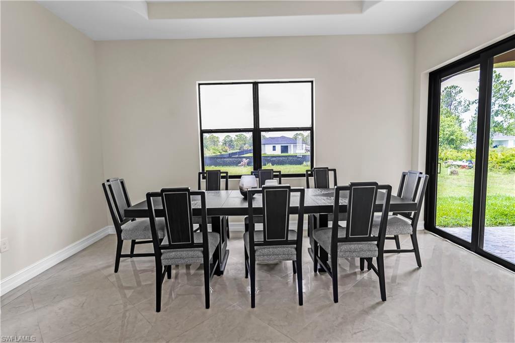 Recessed ceiling detail and large format tile flooring complement the spacious interior