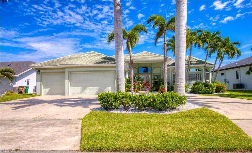 Mediterranean / spanish-style home with a garage, concrete driveway, stucco siding, and a tiled roof