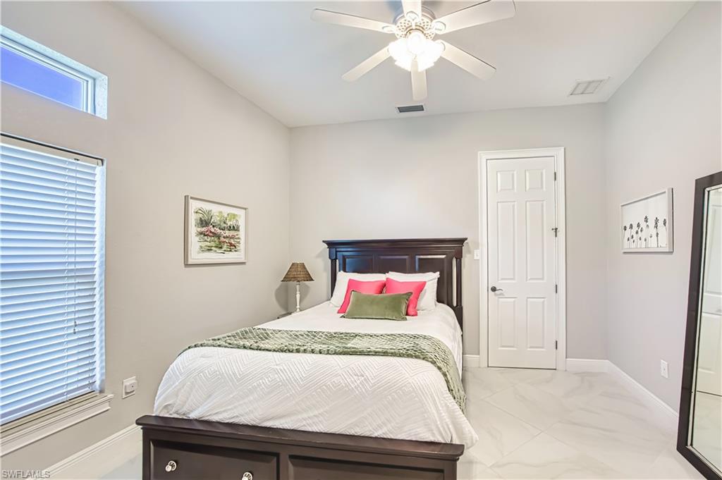 Bedroom with baseboards and ceiling fan