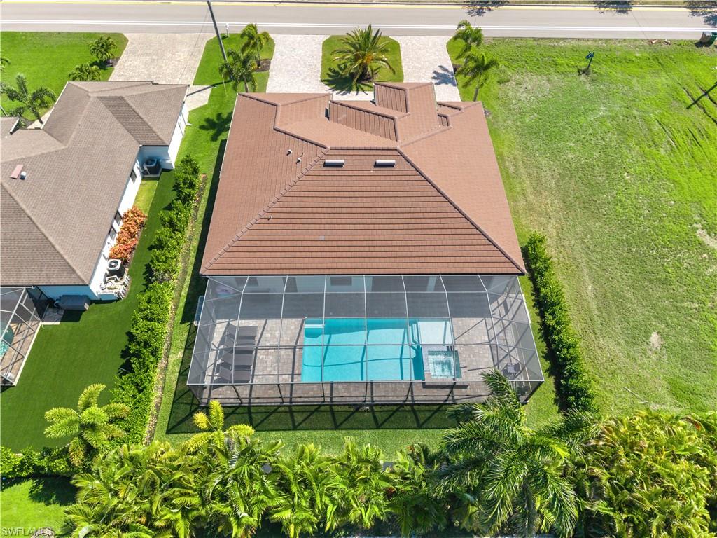 View of subject property with a pool area