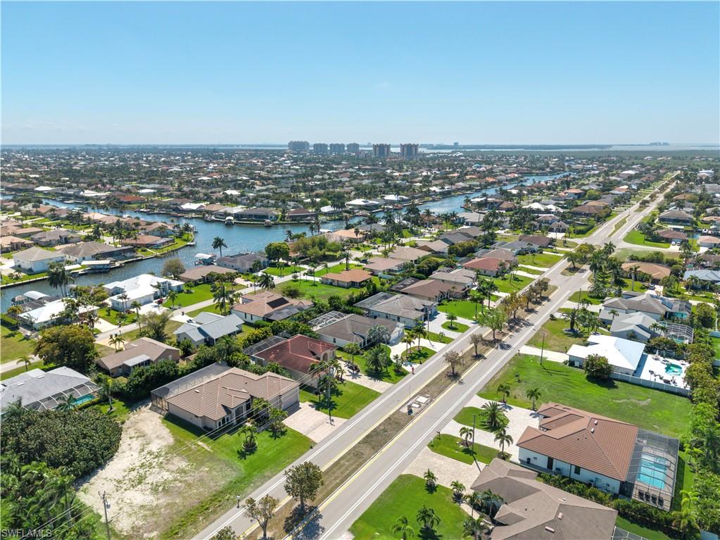 View of property location with nearby suburban area
