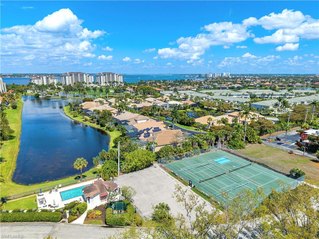 Tennis and pickleball courts and second pool near inland man-made lake