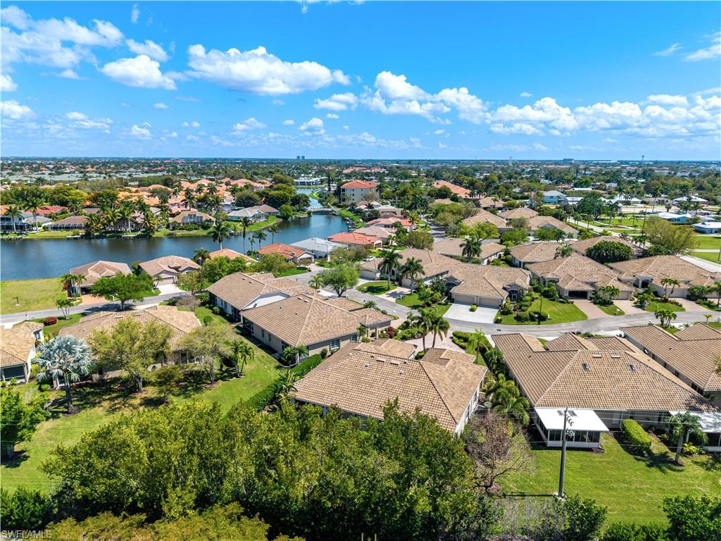 Aerial perspective of suburban area with a large body of water